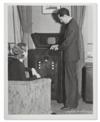 (TELEVISION.) Pair of early press photographs of the new television in action.